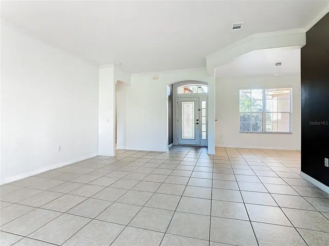 a kitchen with a sink cabinets and window