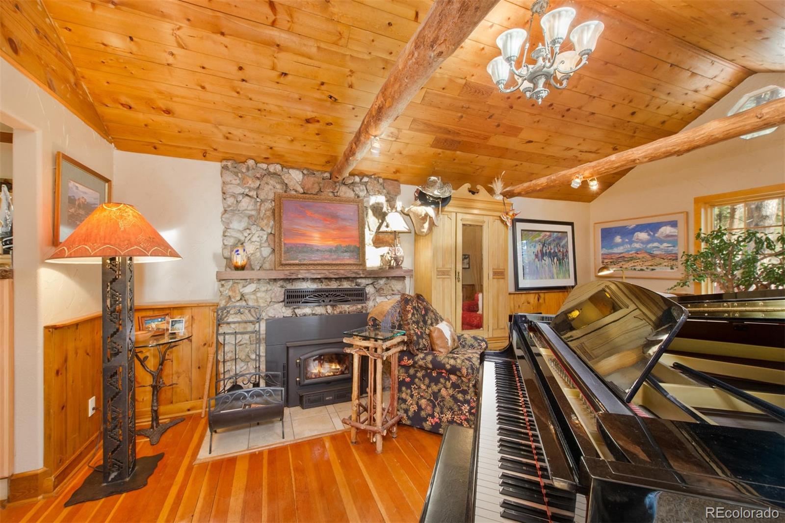 3010 Kerr Gulch Road Evergreen, CO 80439 - Photo 21 of 32 a view of a livingroom with furniture and a kitchen