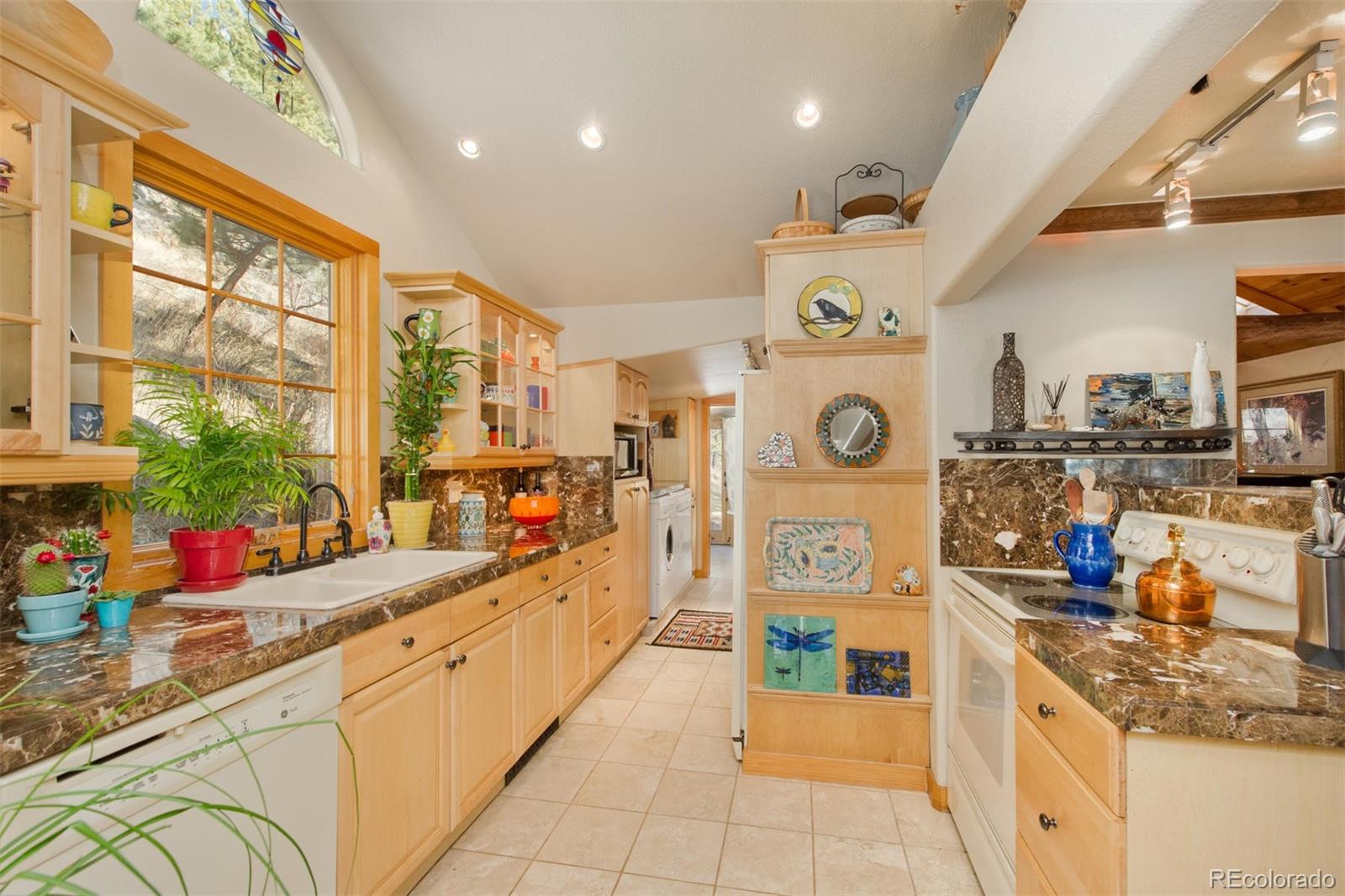3010 Kerr Gulch Road Evergreen, CO 80439 - Photo 5 of 32 a kitchen with lots of counter top space