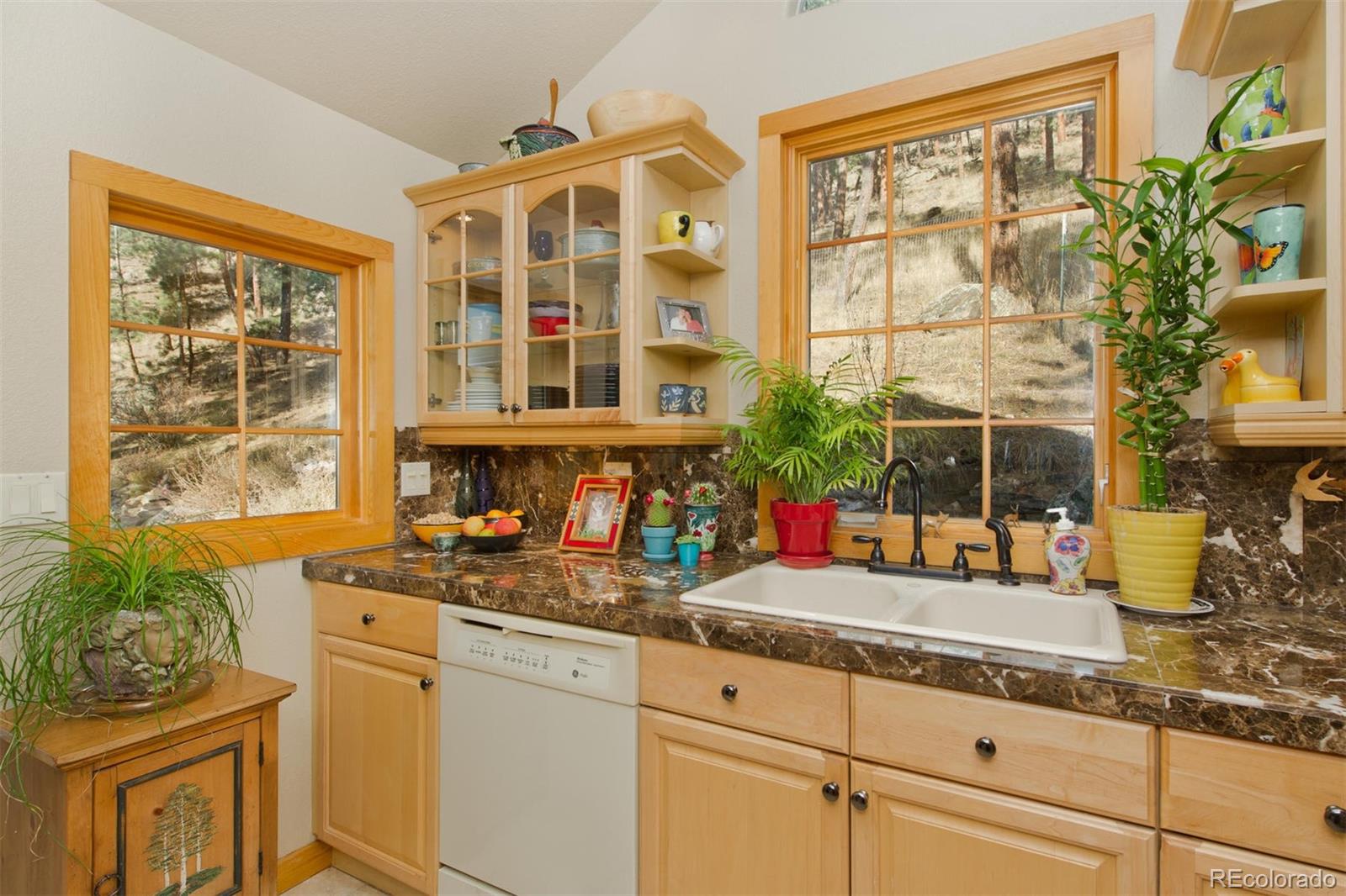 3010 Kerr Gulch Road Evergreen, CO 80439 - Photo 7 of 32 a kitchen with sink and large window