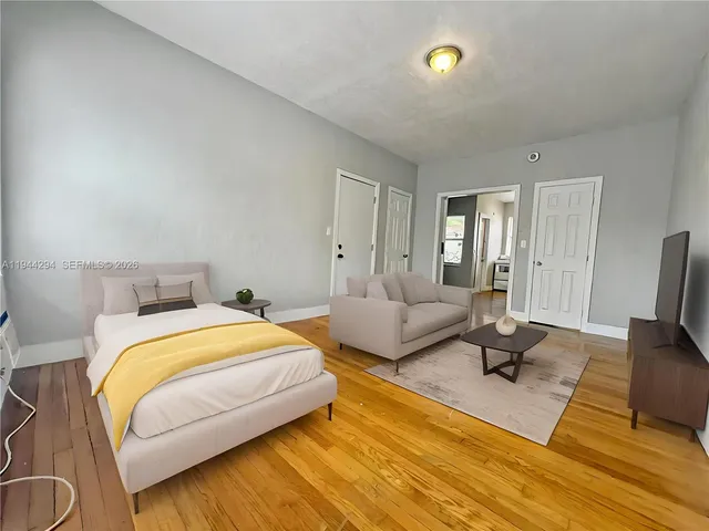 a bedroom with a bed and a couch