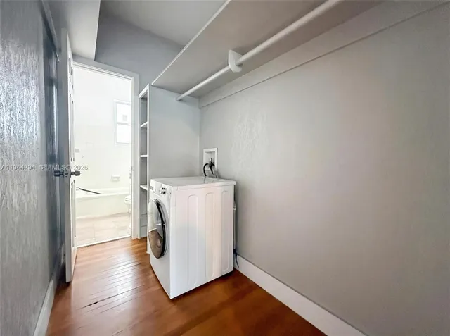 a view of a storage & utility room with a washer dryer