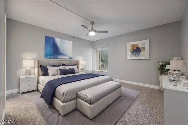 a bedroom with bed and a chandelier