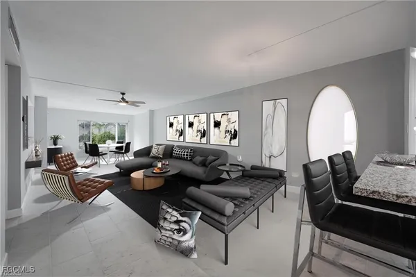 a living room with furniture and a potted plant