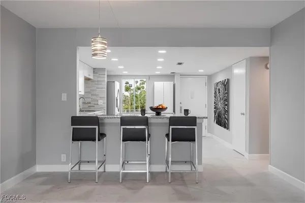 a view of a livingroom with furniture and window
