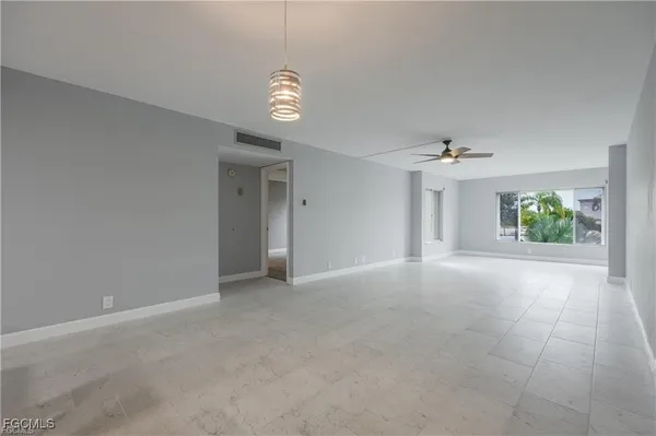 a view of an empty room with a window