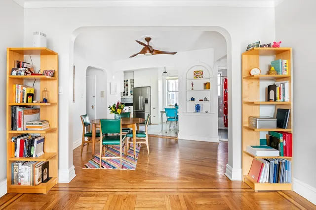 a dining room with furniture and wooden floor