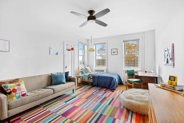 a living room filled with furniture and a chandelier