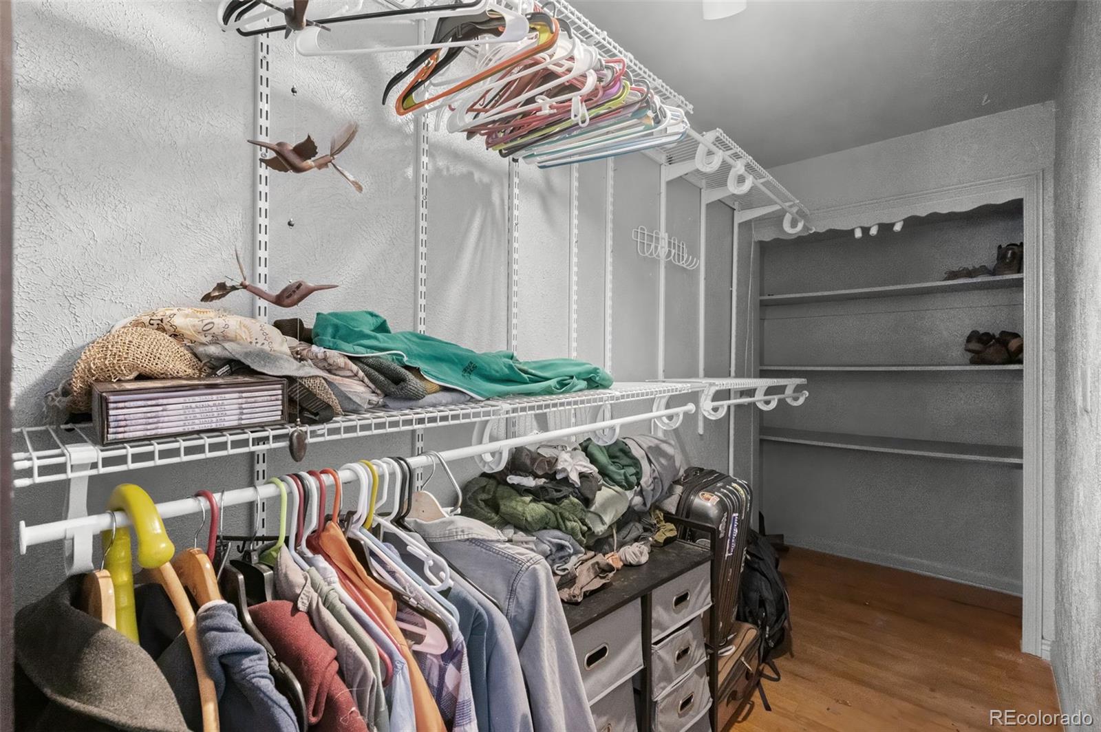 776 South Yates Street Denver, CO 80219 - Photo 26 of 34 a bedroom with a bed and a chandelier