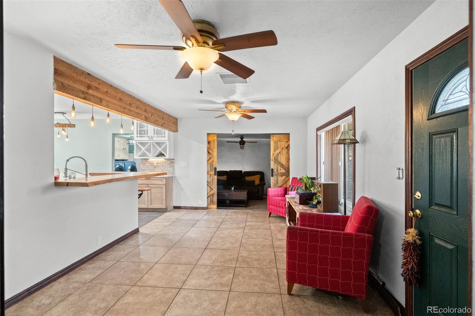 776 South Yates Street Denver, CO 80219 - Photo 5 of 34 a living room with furniture and a fireplace