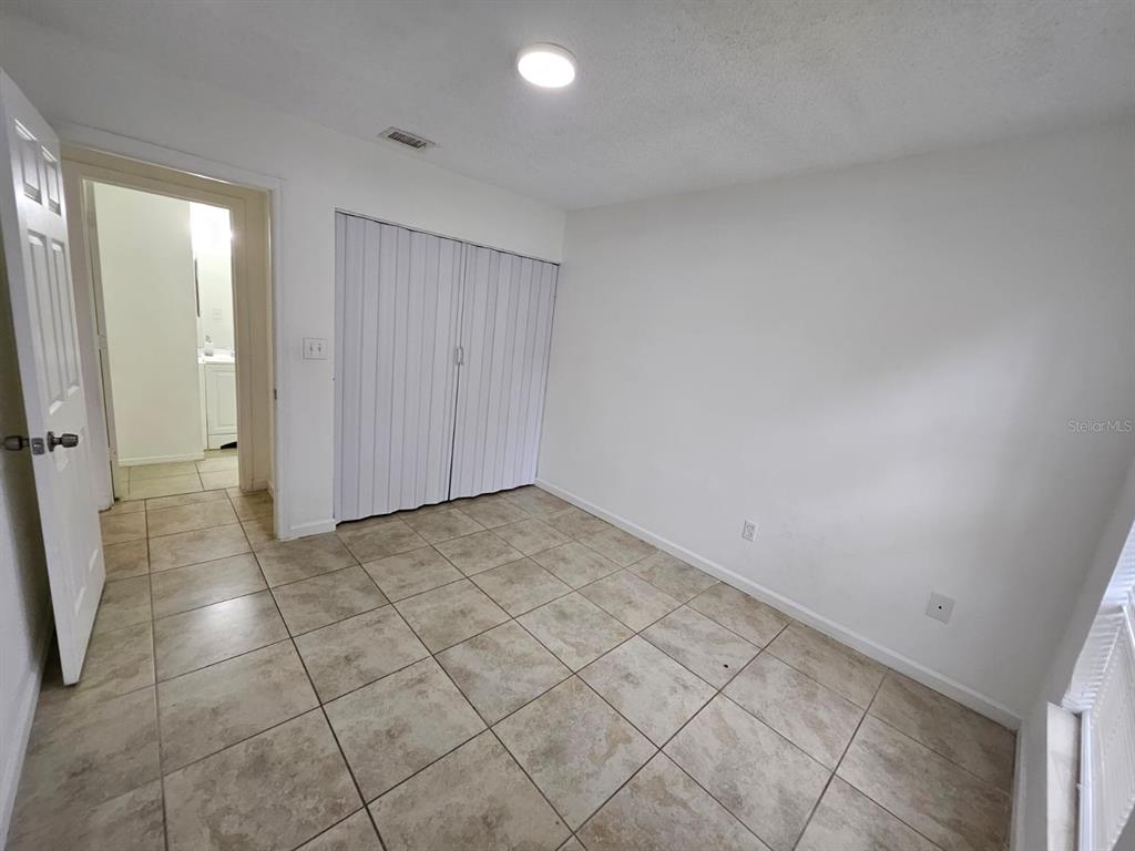 3651 North Goldenrod Road, Unit B#104 Winter Park, FL 32792 - Photo 12 of 21 a view of a livingroom with a pathway