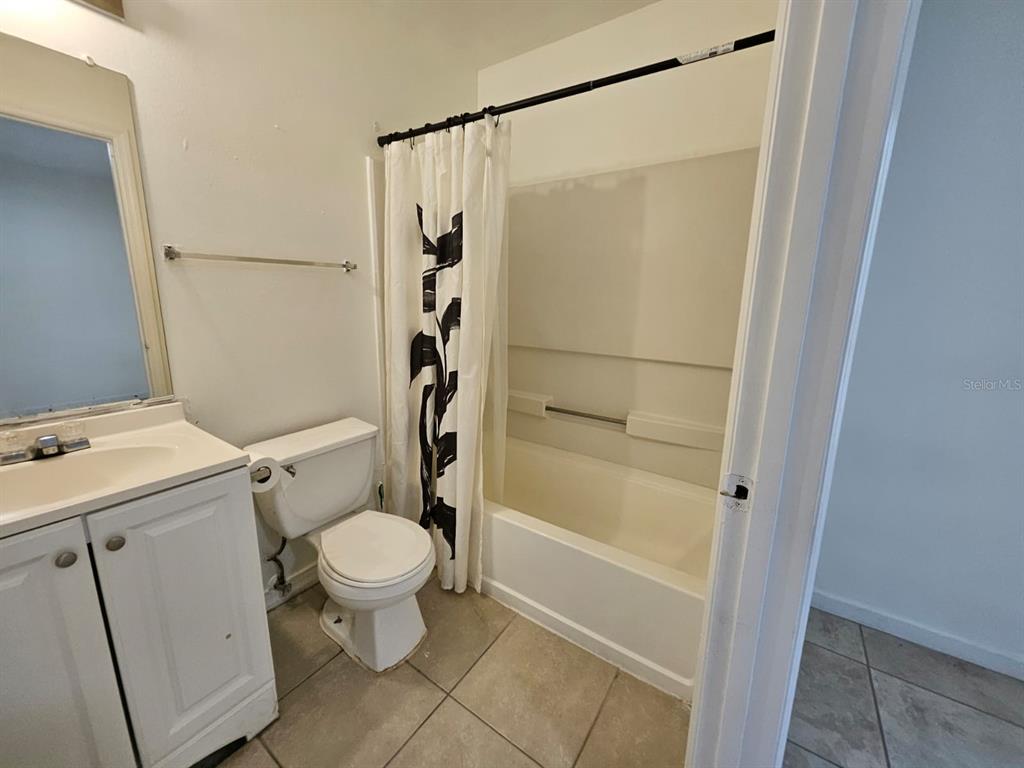 3651 North Goldenrod Road, Unit B#104 Winter Park, FL 32792 - Photo 15 of 21 a bathroom with a toilet and a shower