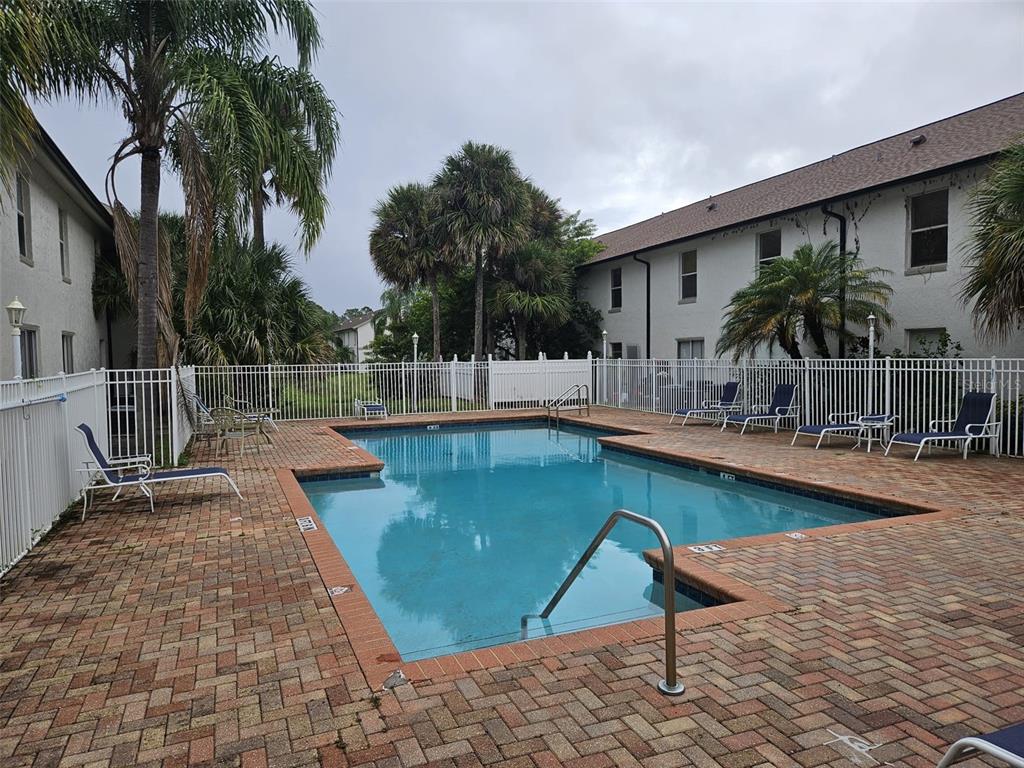 3651 North Goldenrod Road, Unit B#104 Winter Park, FL 32792 - Photo 20 of 21 a view of a swimming pool with a patio
