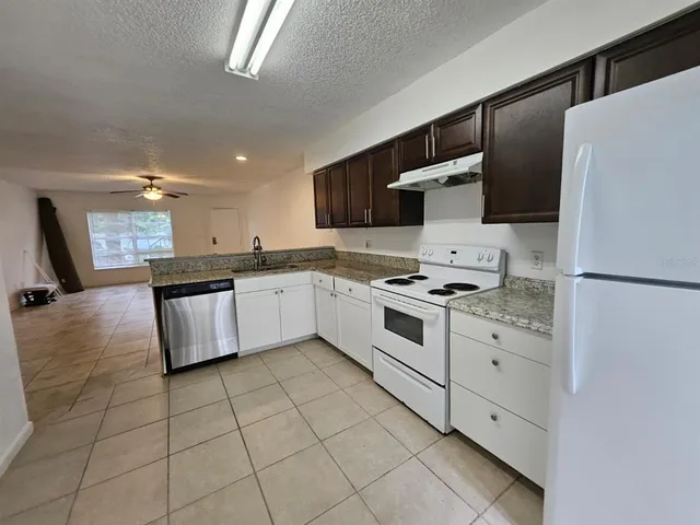 an empty room with a empty space and windows