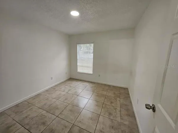 a bathroom with a toilet sink and shower