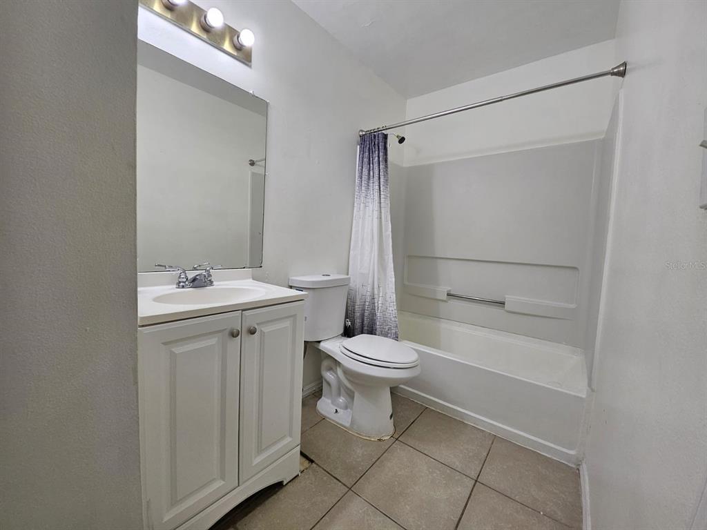 3651 North Goldenrod Road, Unit B#104 Winter Park, FL 32792 - Photo 10 of 21 a bathroom with a toilet sink and shower