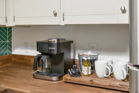 a stove top oven sitting inside of a kitchen