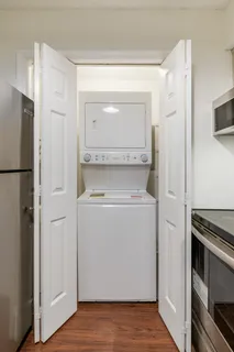 a bedroom with a bed a table and chair