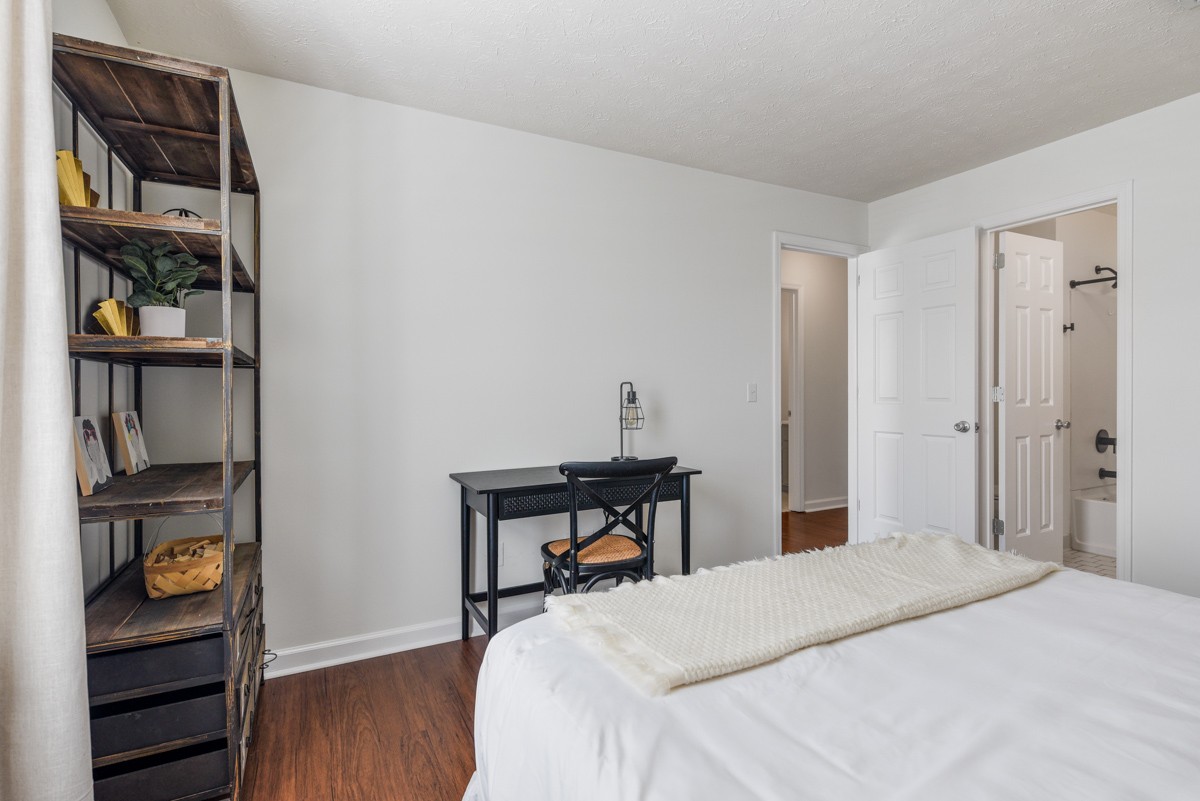 1808 State Street, Unit 307 Nashville, TN 37203 - Photo 19 of 27 a bedroom with a bed and a closet