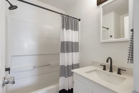 a view of a room with wooden floor