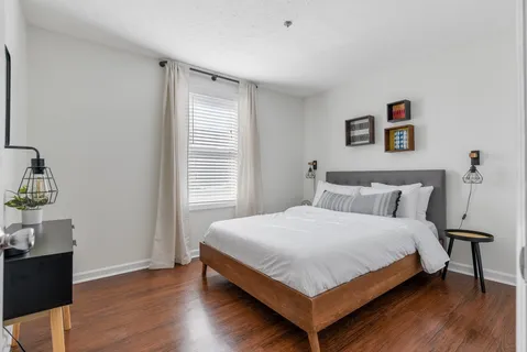 a room with a table and potted plant
