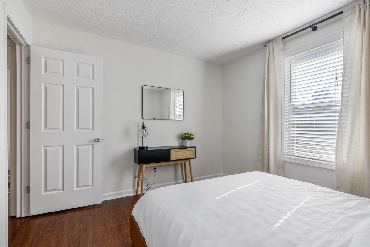 1808 State Street, Unit 307 Nashville, TN 37203 - Photo 24 of 27 a bedroom with a bed and a window