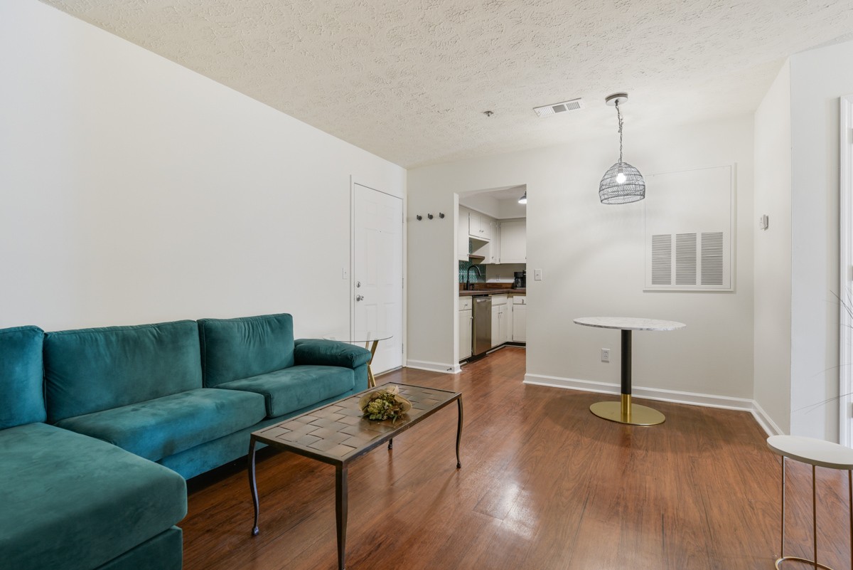 1808 State Street, Unit 307 Nashville, TN 37203 - Photo 6 of 27 a living room with furniture and a wooden floor