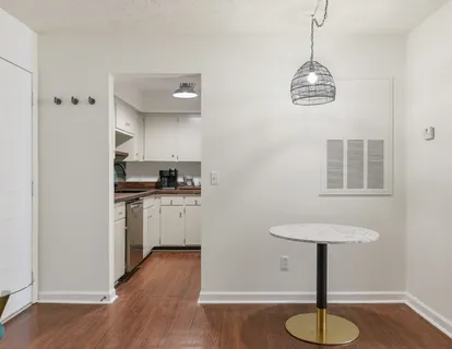 a kitchen with appliances a refrigerator and a sink