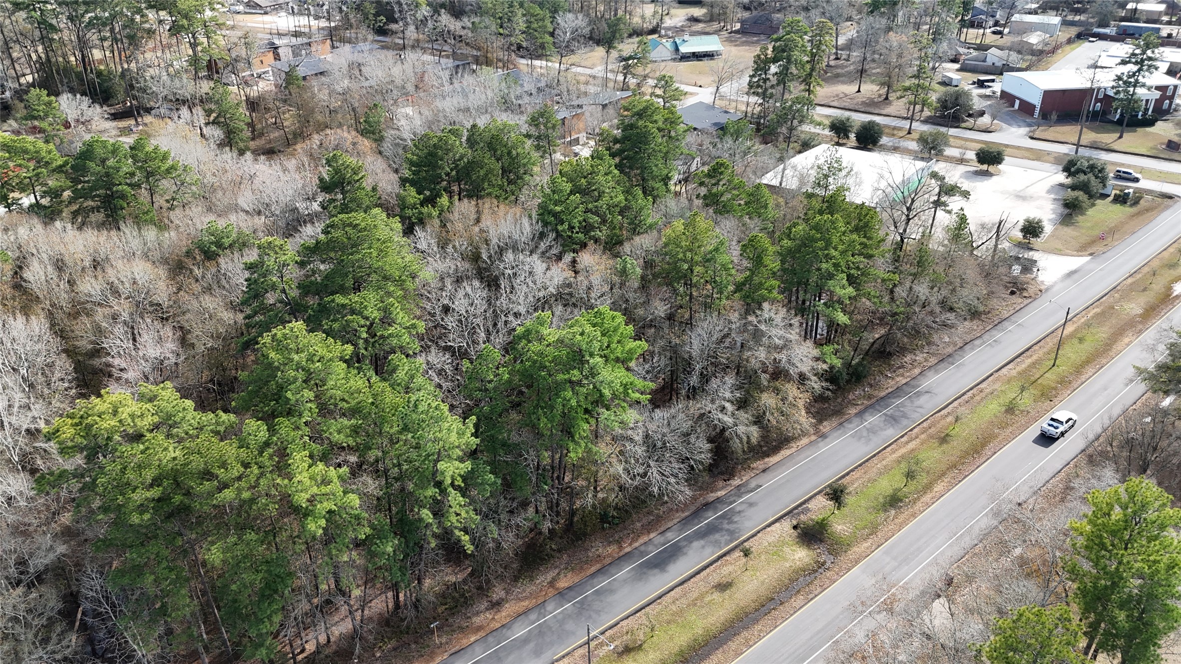 0 Roman Forest Boulevard New Caney, TX 77357 - Photo 8 of 11 a view of a lake with a city view