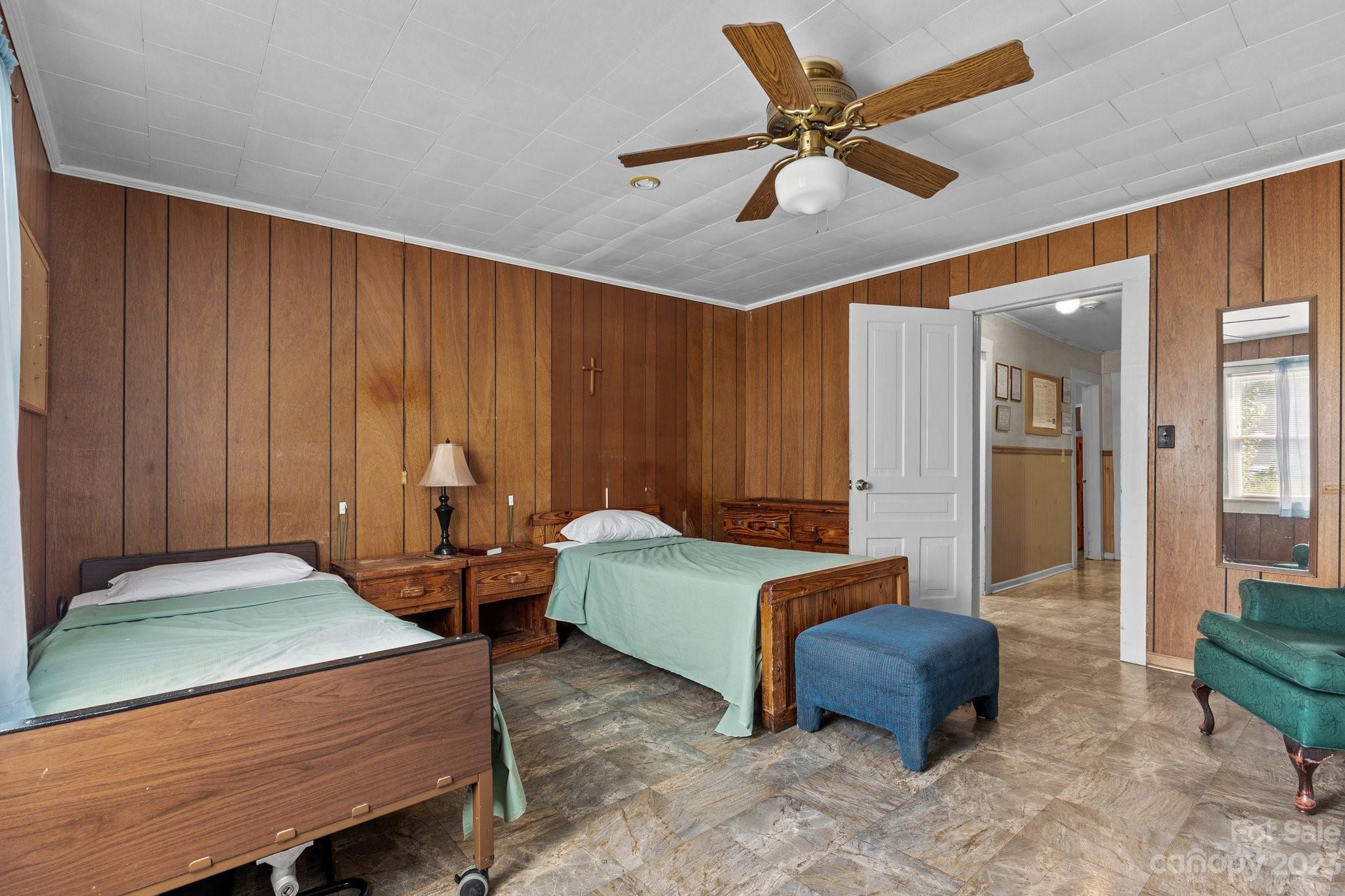 602 Aileen Avenue Biscoe, NC 27209 - Photo 12 of 27 a bedroom with furniture and a chandelier fan
