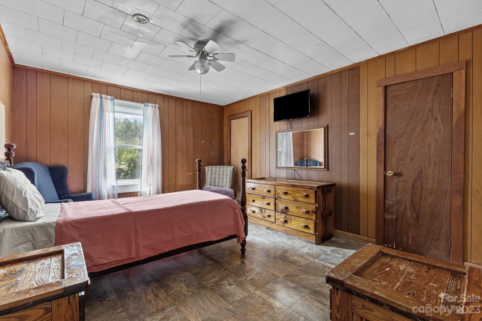 602 Aileen Avenue Biscoe, NC 27209 - Photo 14 of 27 a bedroom with a bed dresser and window
