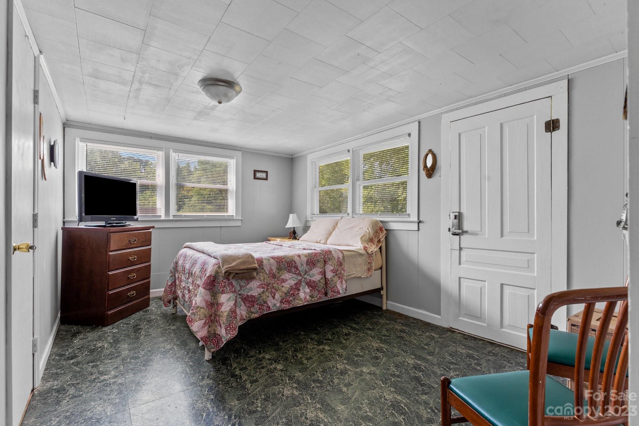 602 Aileen Avenue Biscoe, NC 27209 - Photo 18 of 27 a bedroom with a bed and wooden floor