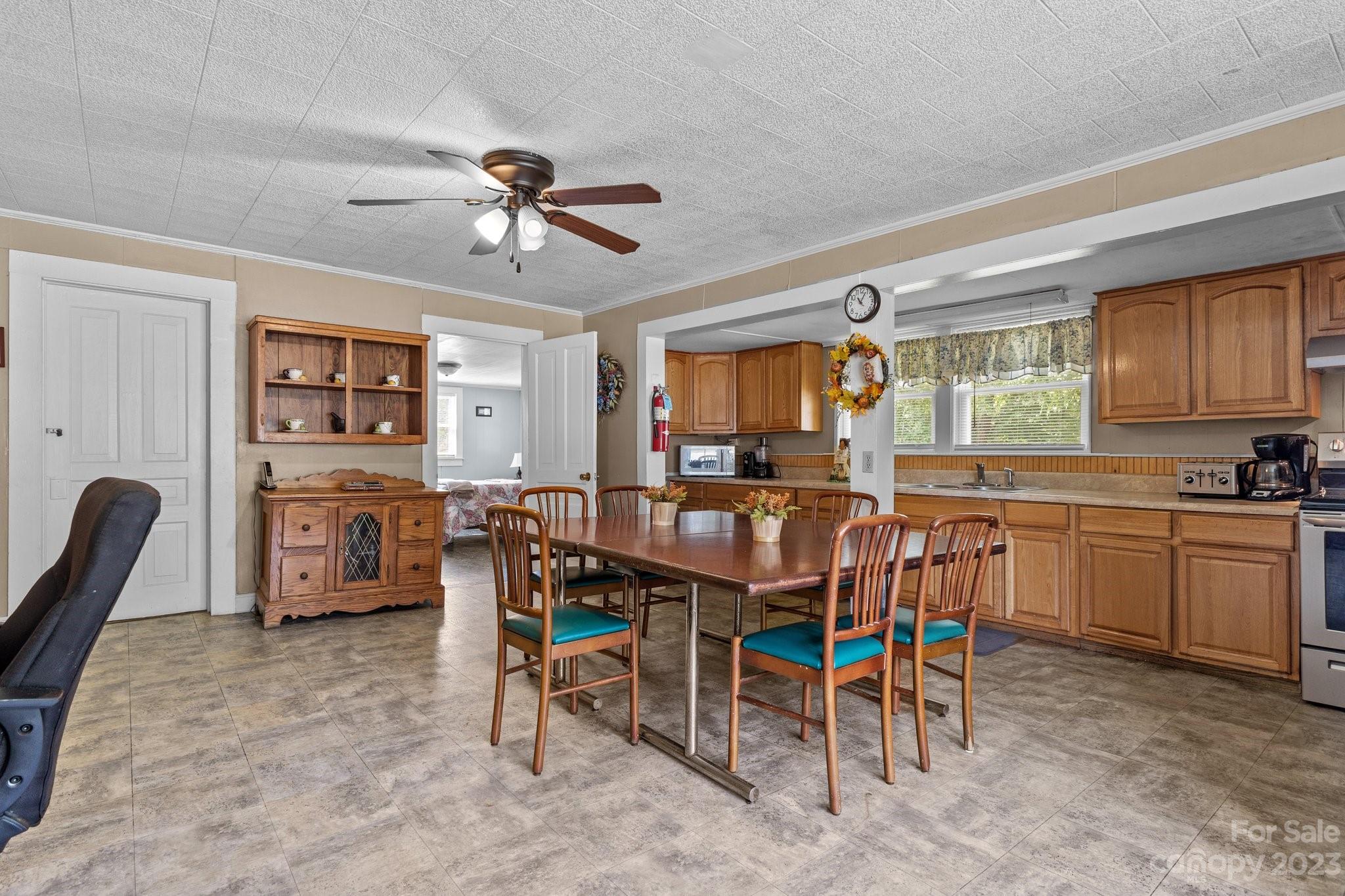 602 Aileen Avenue Biscoe, NC 27209 - Photo 22 of 27 a view of a dining room with furniture window and wooden floor