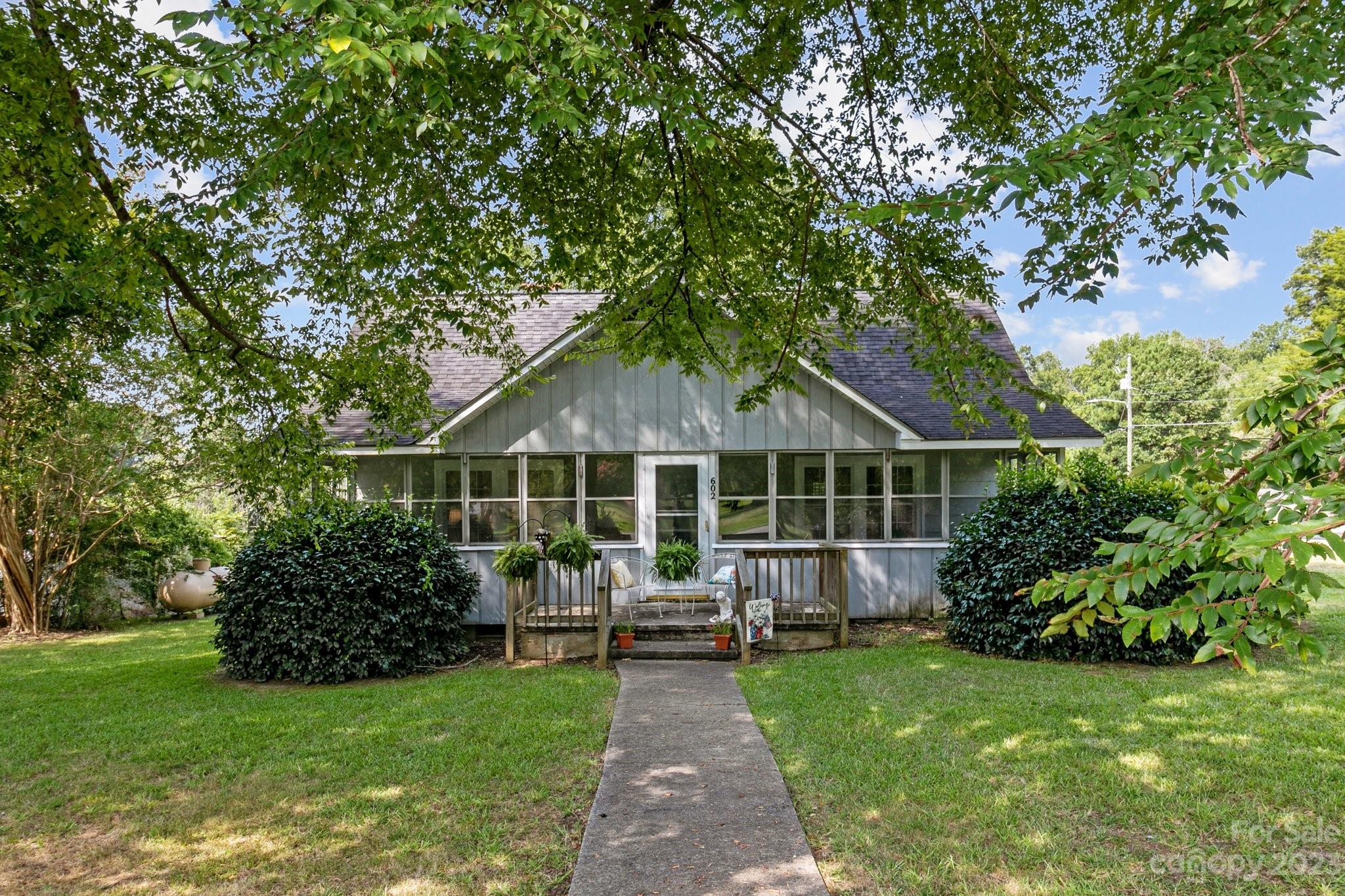 602 Aileen Avenue Biscoe, NC 27209 - Photo 26 of 27 a front view of a house with garden