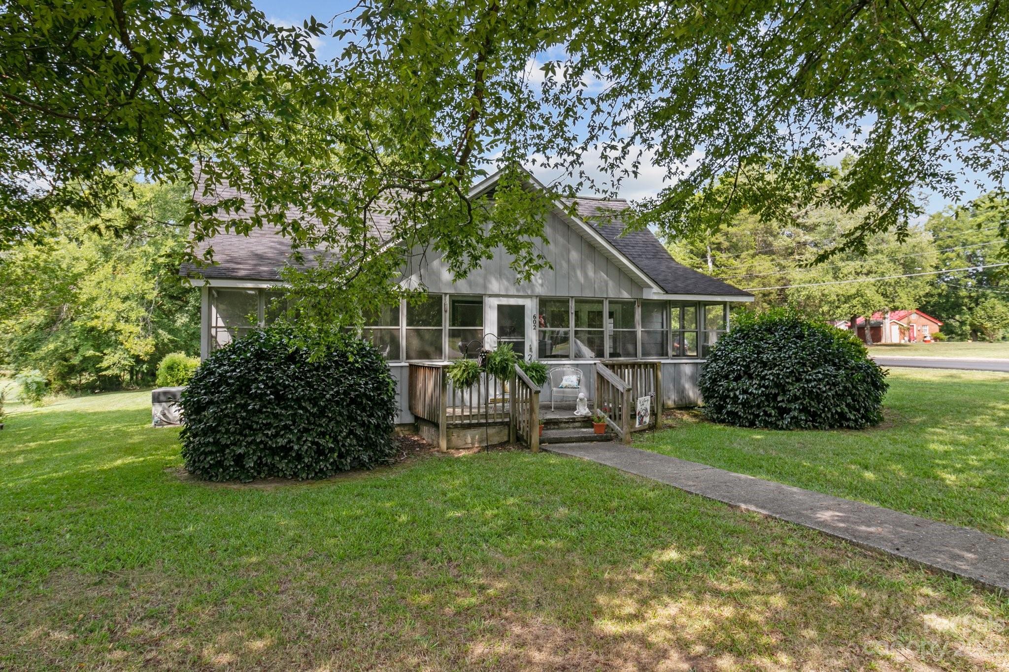 602 Aileen Avenue Biscoe, NC 27209 - Photo 27 of 27 a view of a house with backyard sitting area and garden
