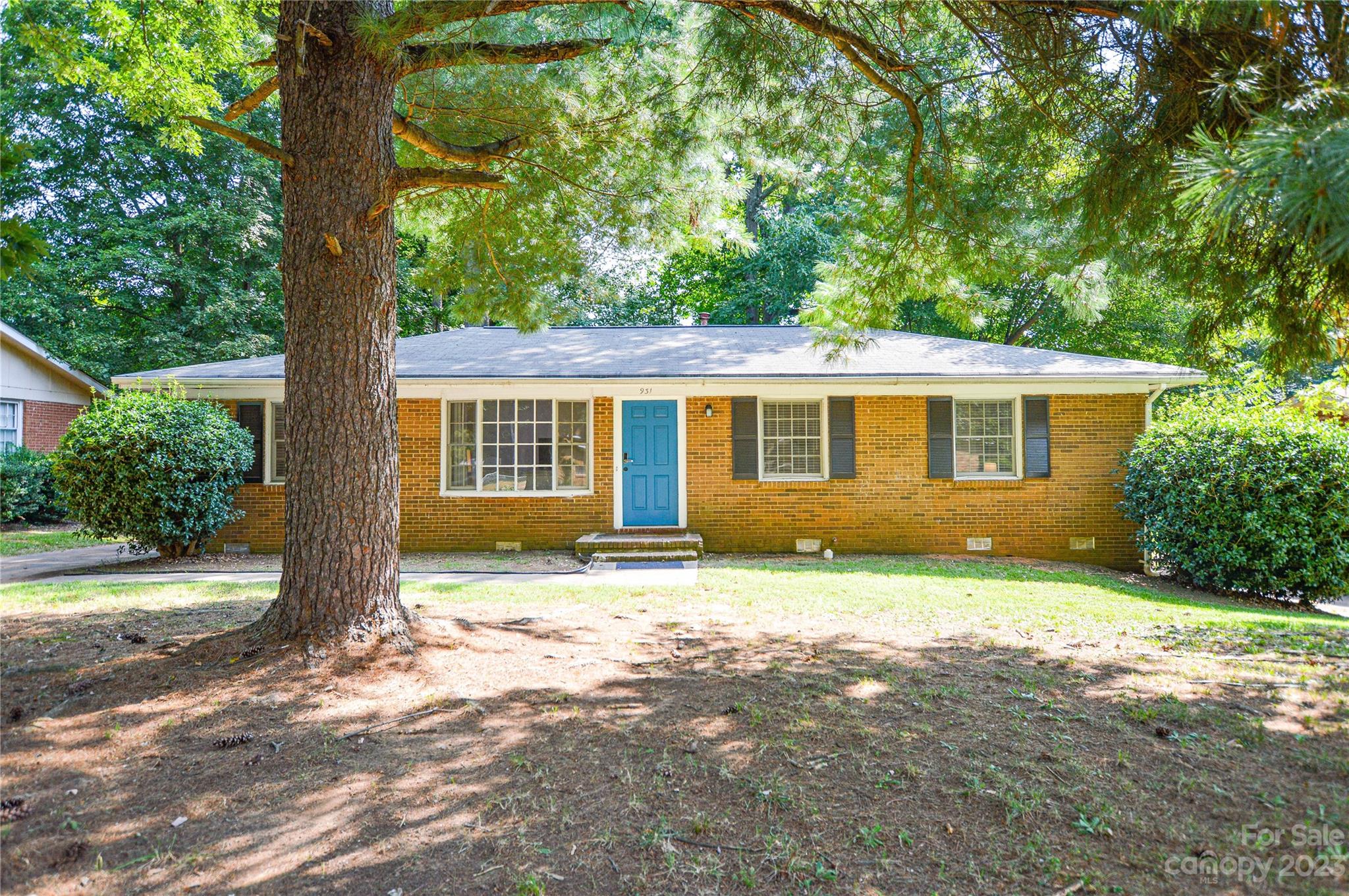 931 Tilden Road Charlotte, NC 28214 - Photo 1 of 33 a view of a house with backyard and a tree