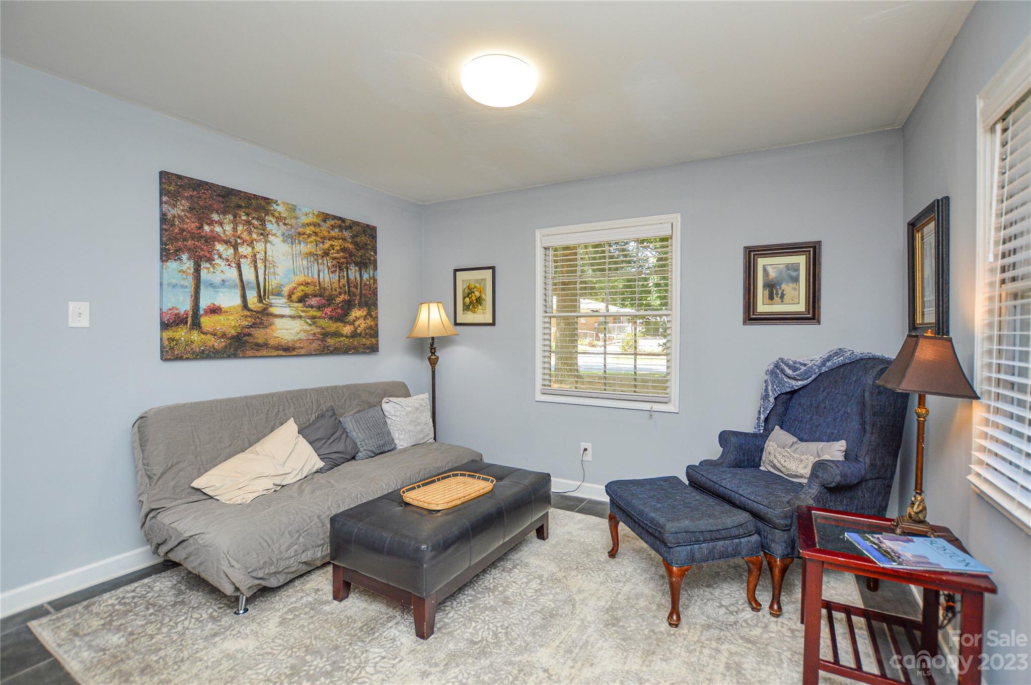 931 Tilden Road Charlotte, NC 28214 - Photo 11 of 33 a living room with furniture a rug and a window