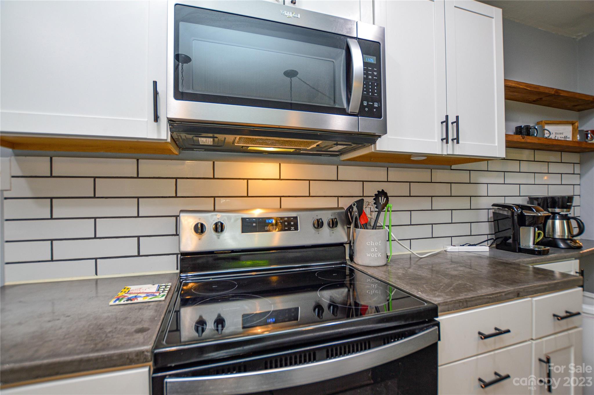 931 Tilden Road Charlotte, NC 28214 - Photo 18 of 33 a stove top oven sitting inside of a kitchen
