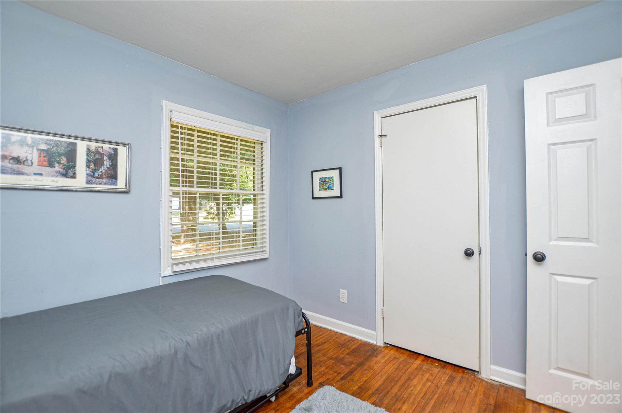 931 Tilden Road Charlotte, NC 28214 - Photo 20 of 33 a bed room with a bed and a window