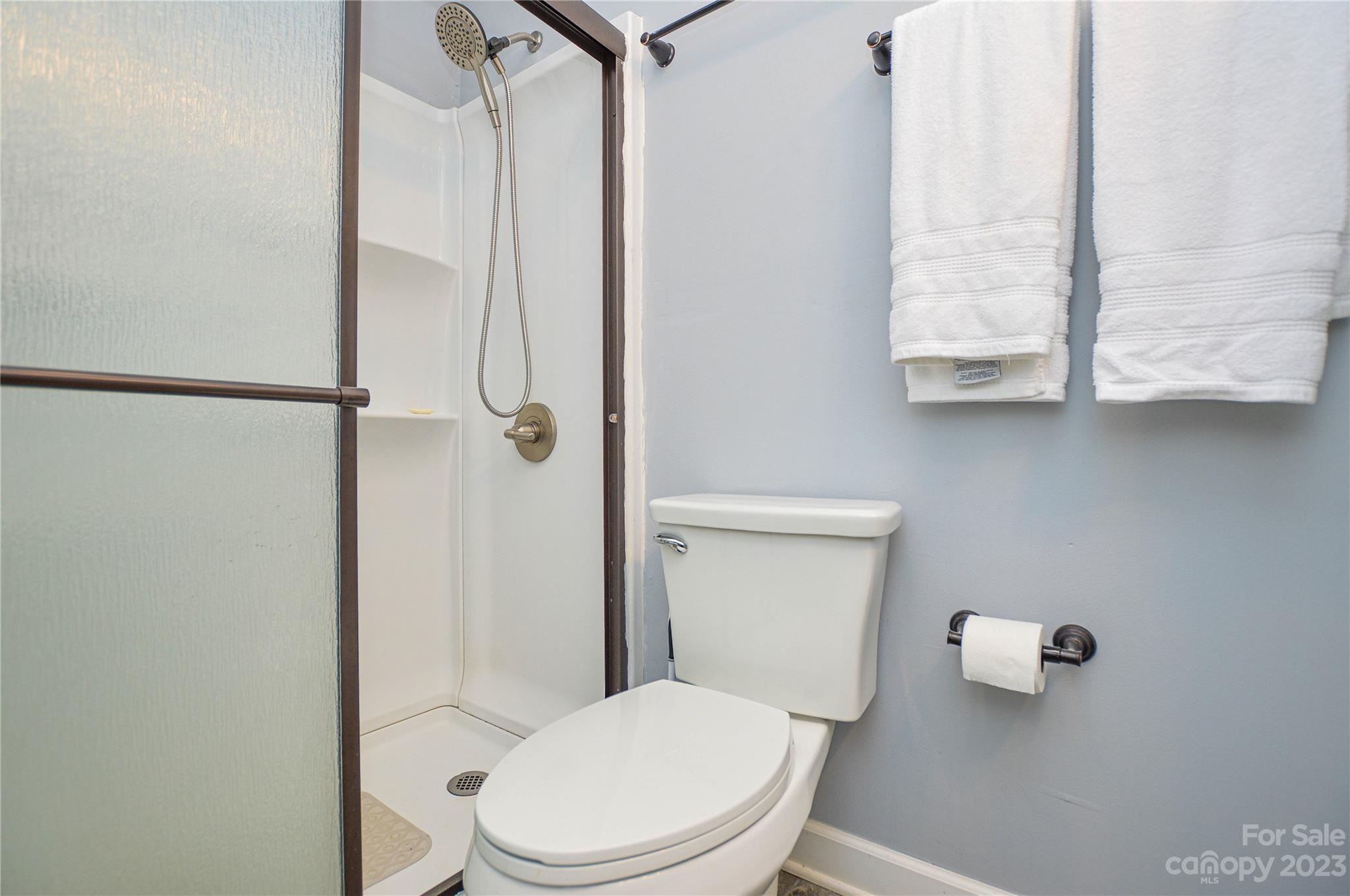 931 Tilden Road Charlotte, NC 28214 - Photo 25 of 33 a white toilet sitting next to a bathroom sink