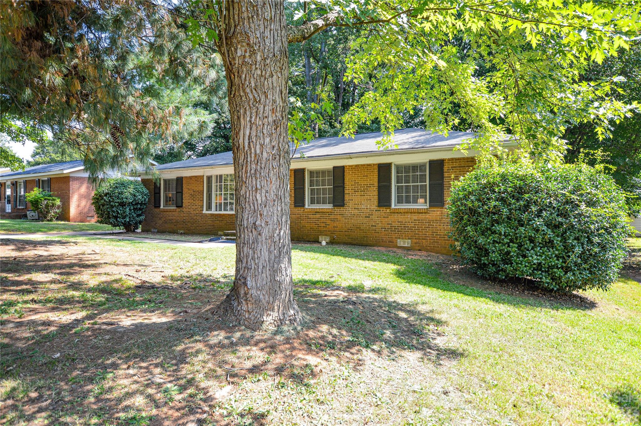 931 Tilden Road Charlotte, NC 28214 - Photo 3 of 33 a view of a house with a yard