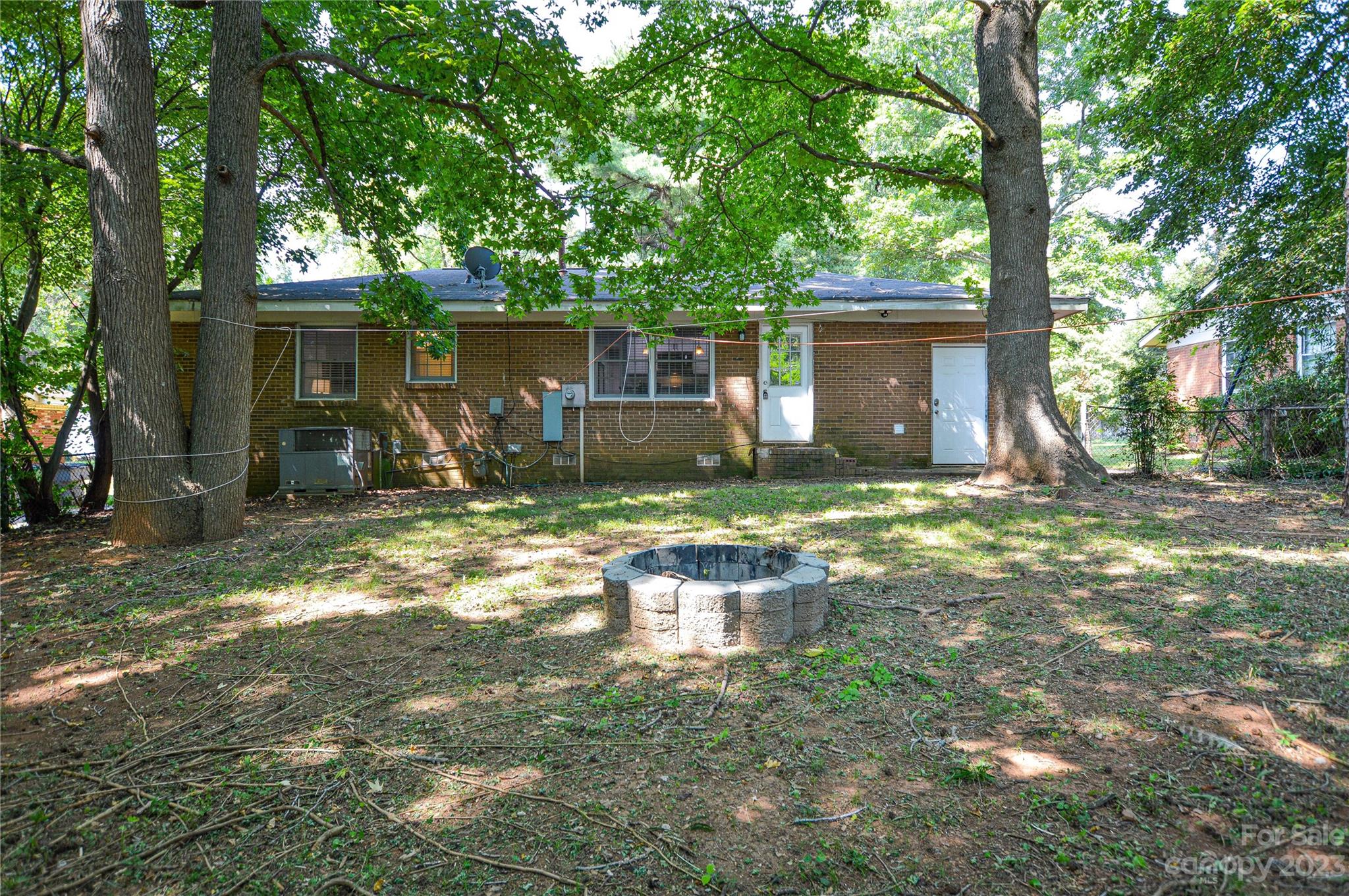 931 Tilden Road Charlotte, NC 28214 - Photo 31 of 33 a backyard of a house with yard and trees