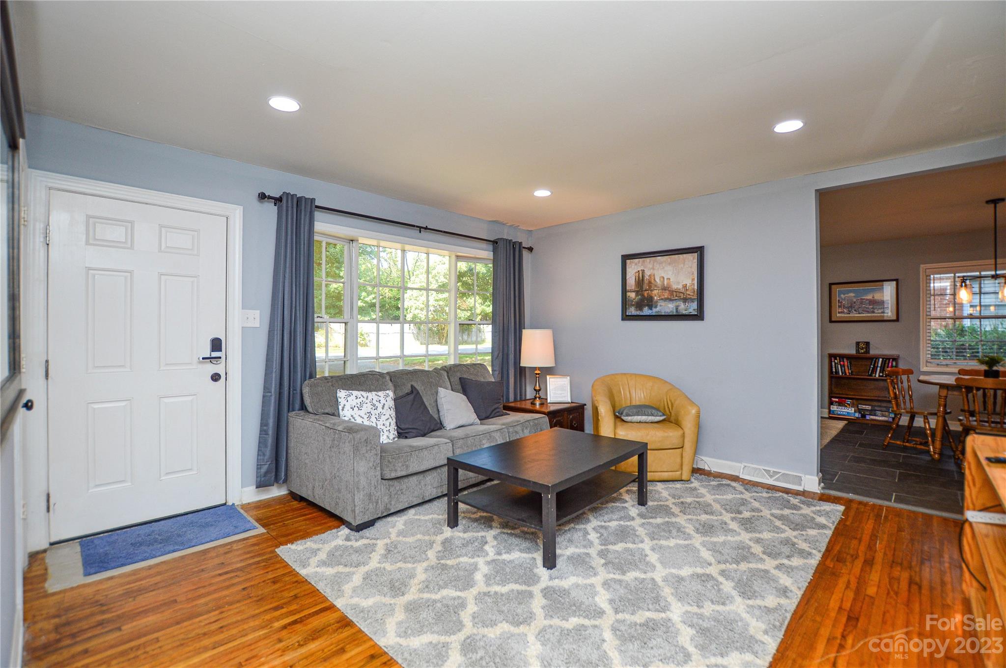 931 Tilden Road Charlotte, NC 28214 - Photo 6 of 33 a living room with furniture and a rug