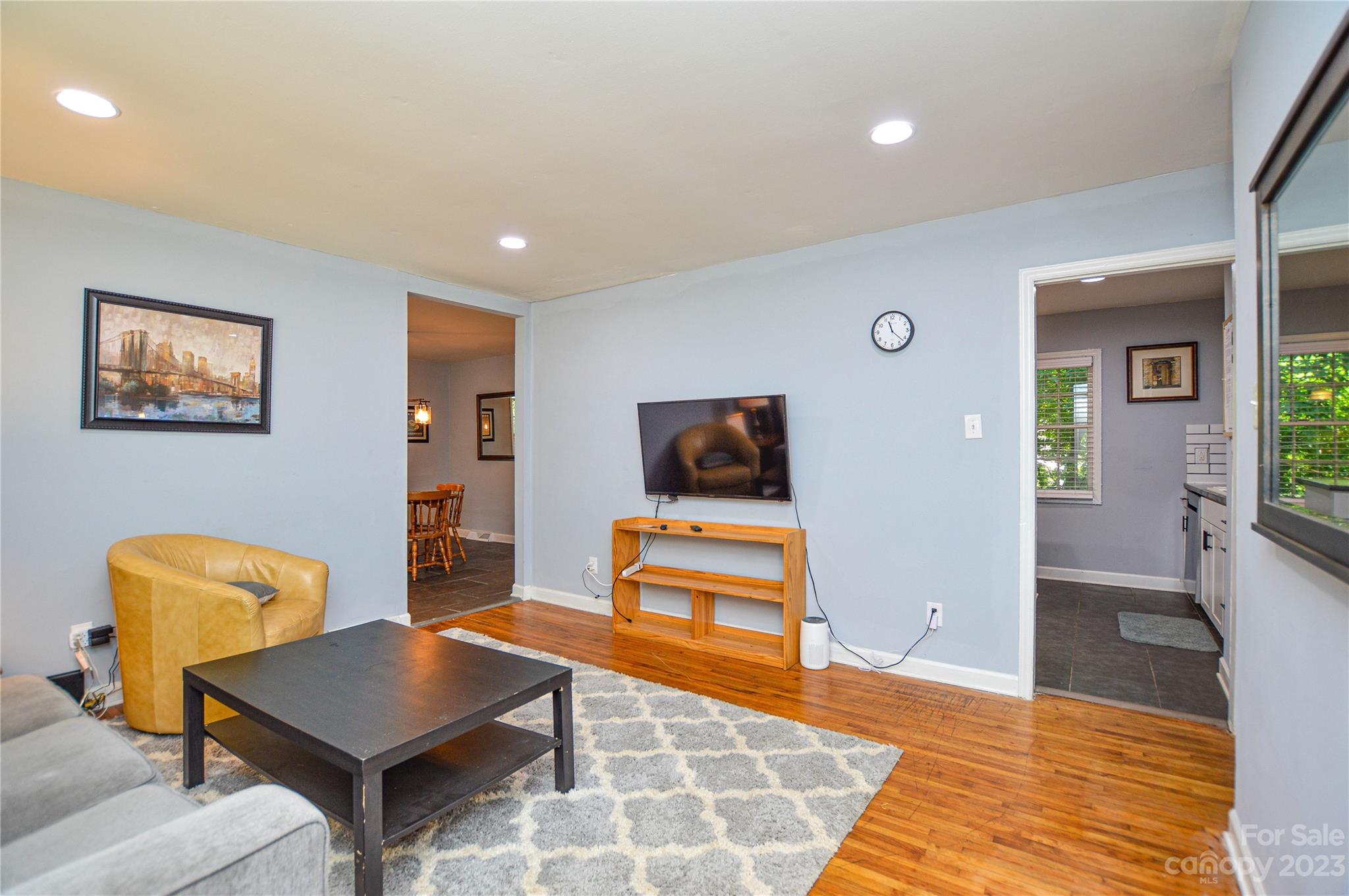 931 Tilden Road Charlotte, NC 28214 - Photo 8 of 33 a living room with furniture and a flat screen tv