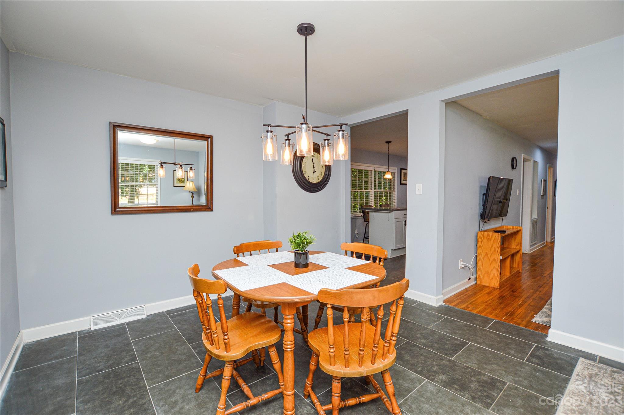 931 Tilden Road Charlotte, NC 28214 - Photo 10 of 33 a dining room table chairs and a table