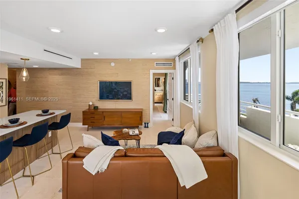 a bedroom with a bed and a glass door