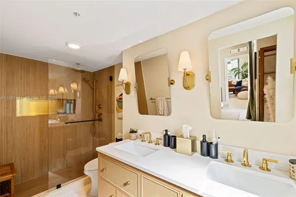 a bathroom with a sink vanity granite and a mirror