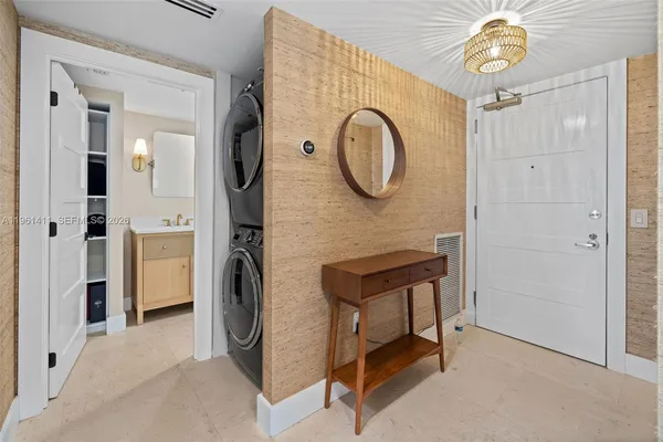 a view of a hallway with washer and dryer