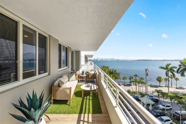 a view of balcony with furniture