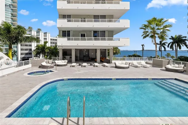 a view of pool with outdoor seating